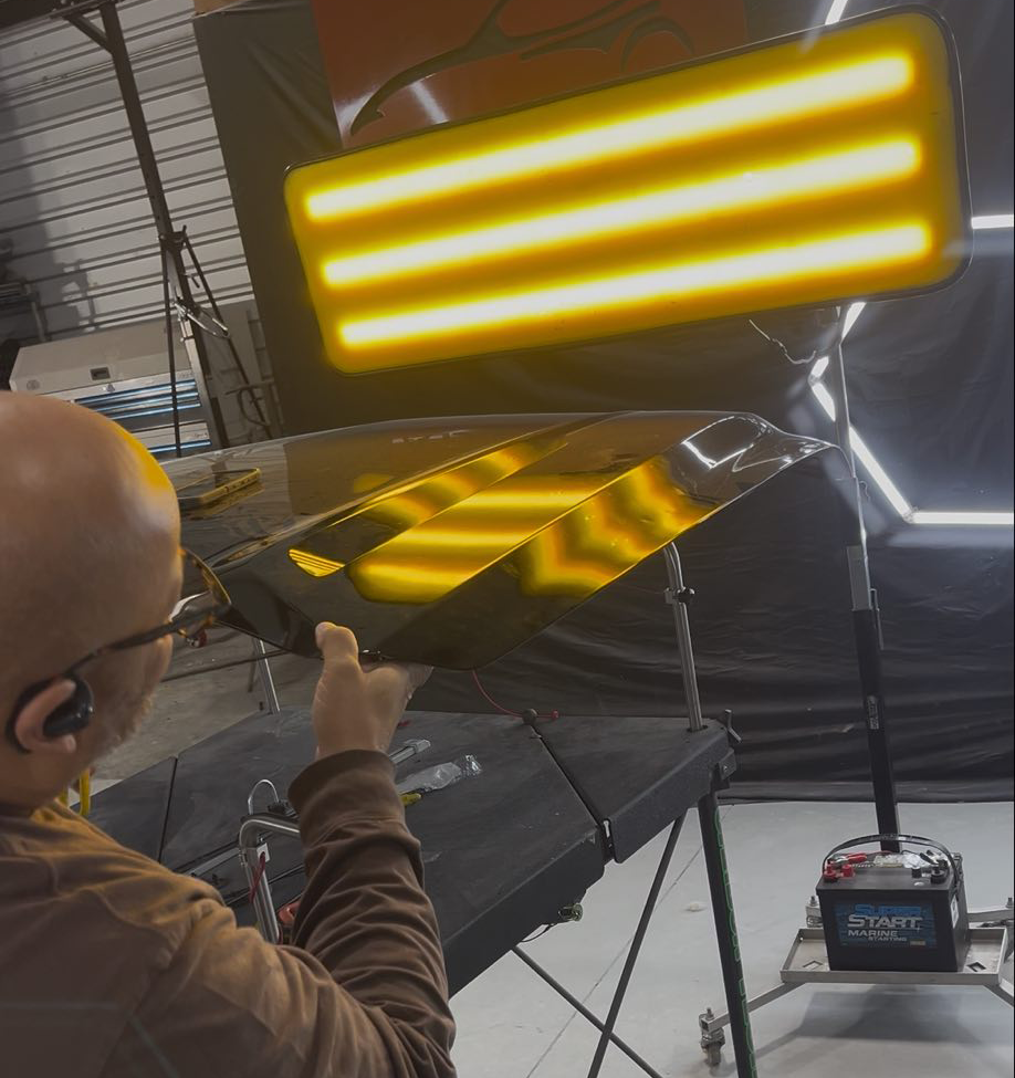 Dent Tech of Memphis performing mobile paintless dent repair on a vehicle hood